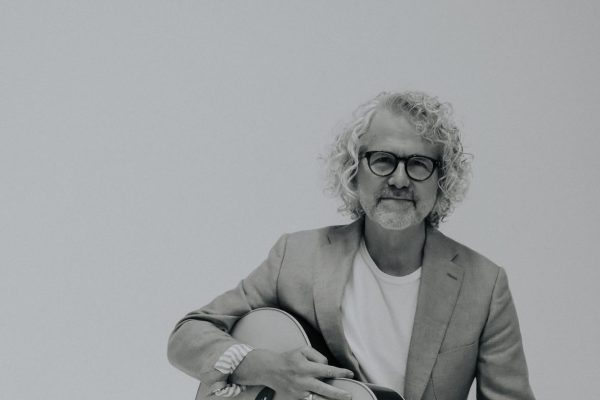 Black_and_White_on_Stool_with_Guitar_Looking_at_Cam